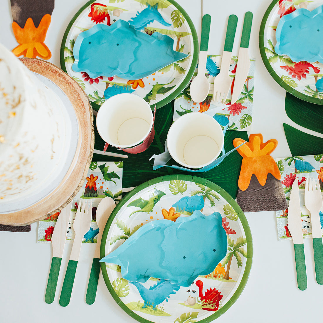 Dinosaur birthday party plates and napkins for cake